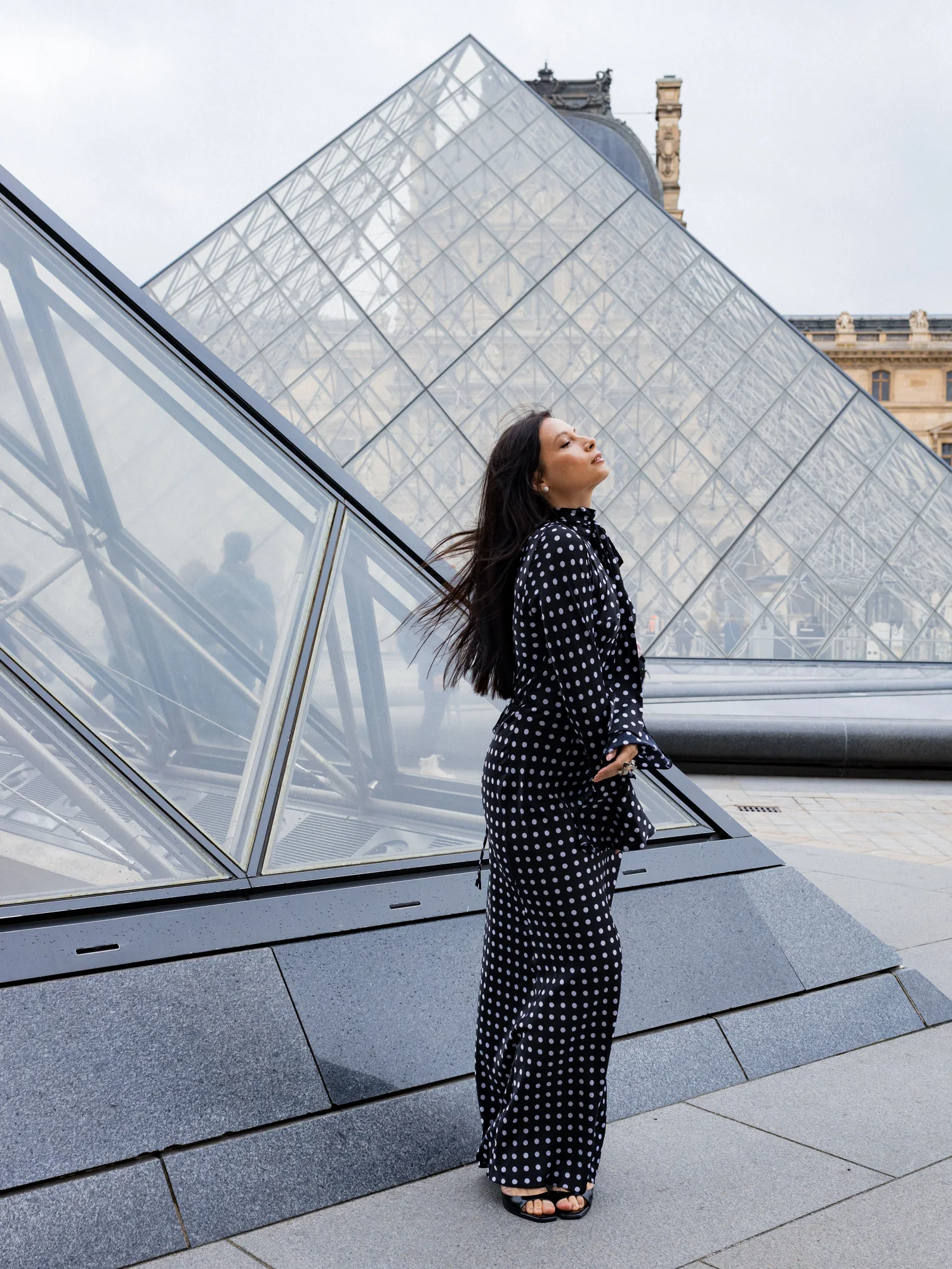 Fashion model in Paris with the Eiffel Tower in view