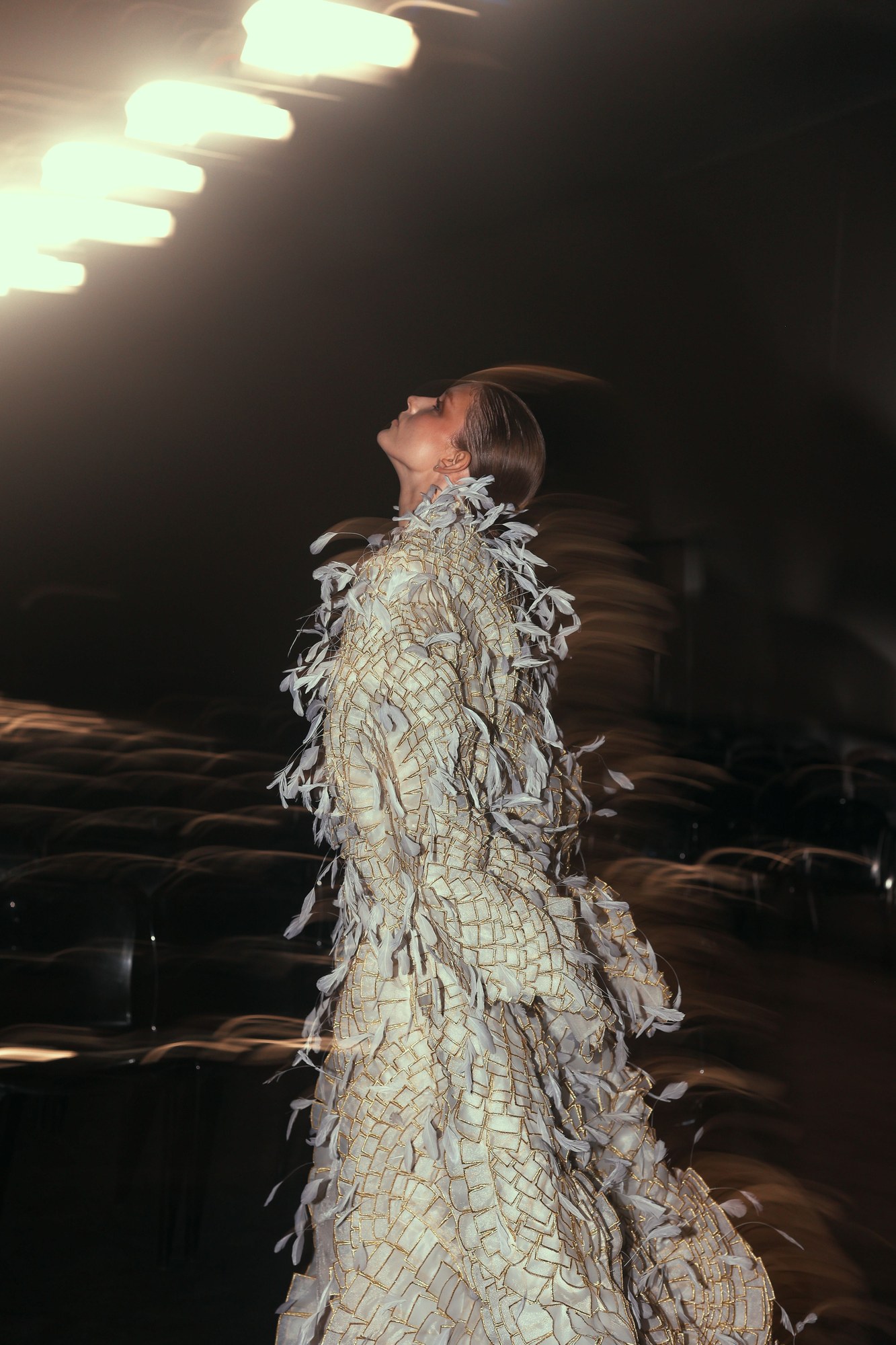 High-fashion model in a dramatic black couture gown